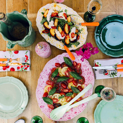 Taste of Italy - Table of splatterware dishes, plates and cutlery with Mediterranean salad